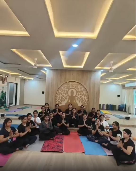 Students aligned in yoga postures
